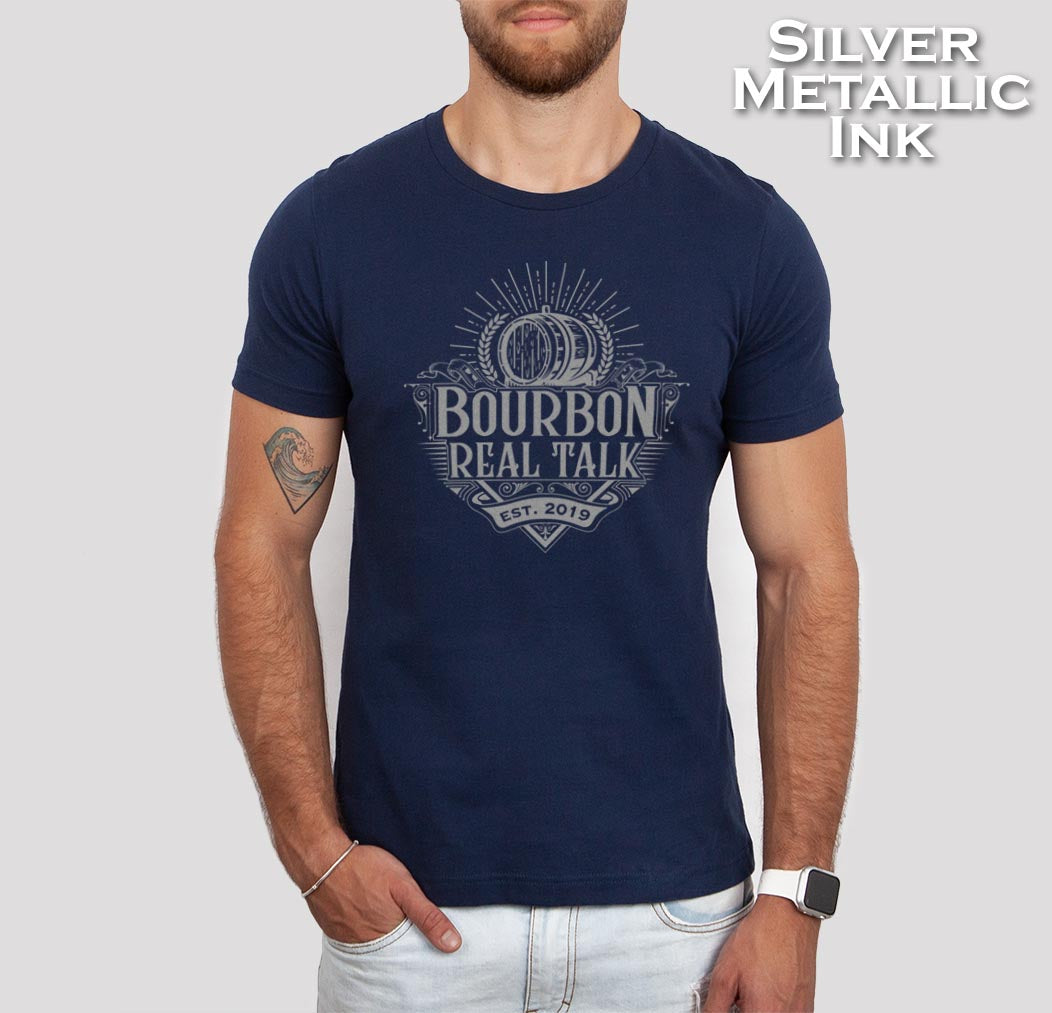Man wearing a navy Bourbon Real Talk shirt with silver metallic ink