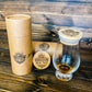cardboard tube with bamboo lids including a whiskey glass with a lid on top