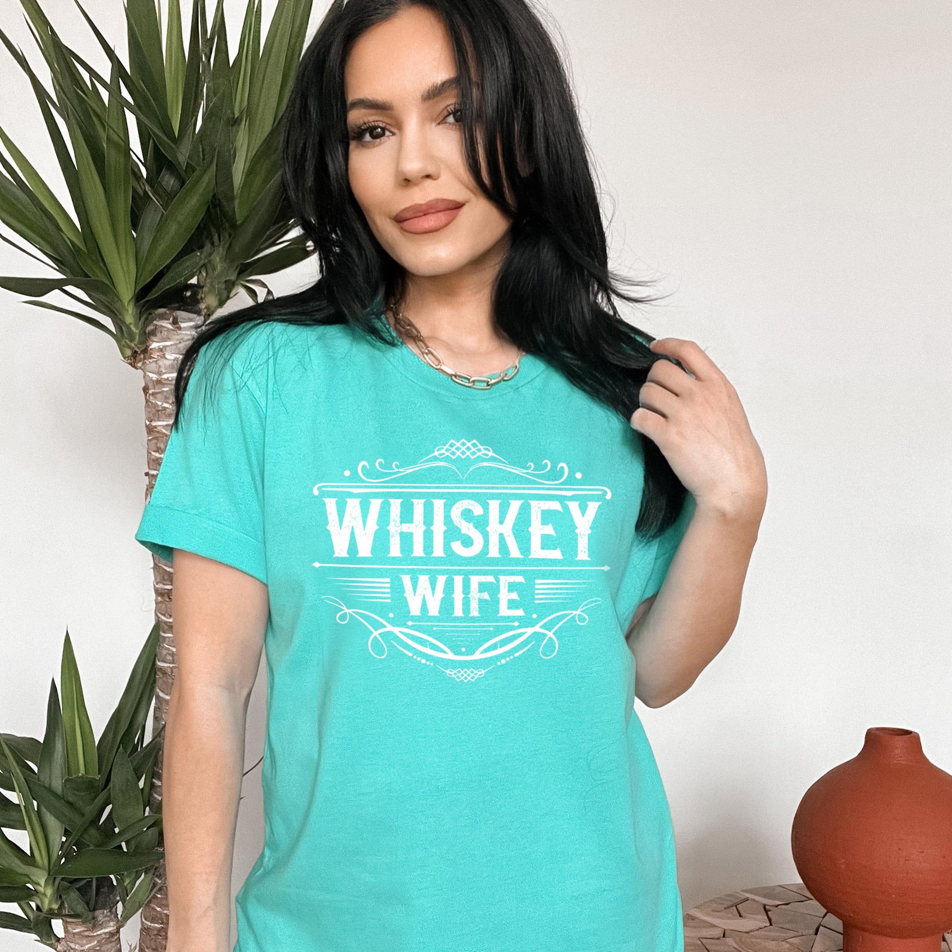 woman wearing light aqua whiskey wife t-shirt